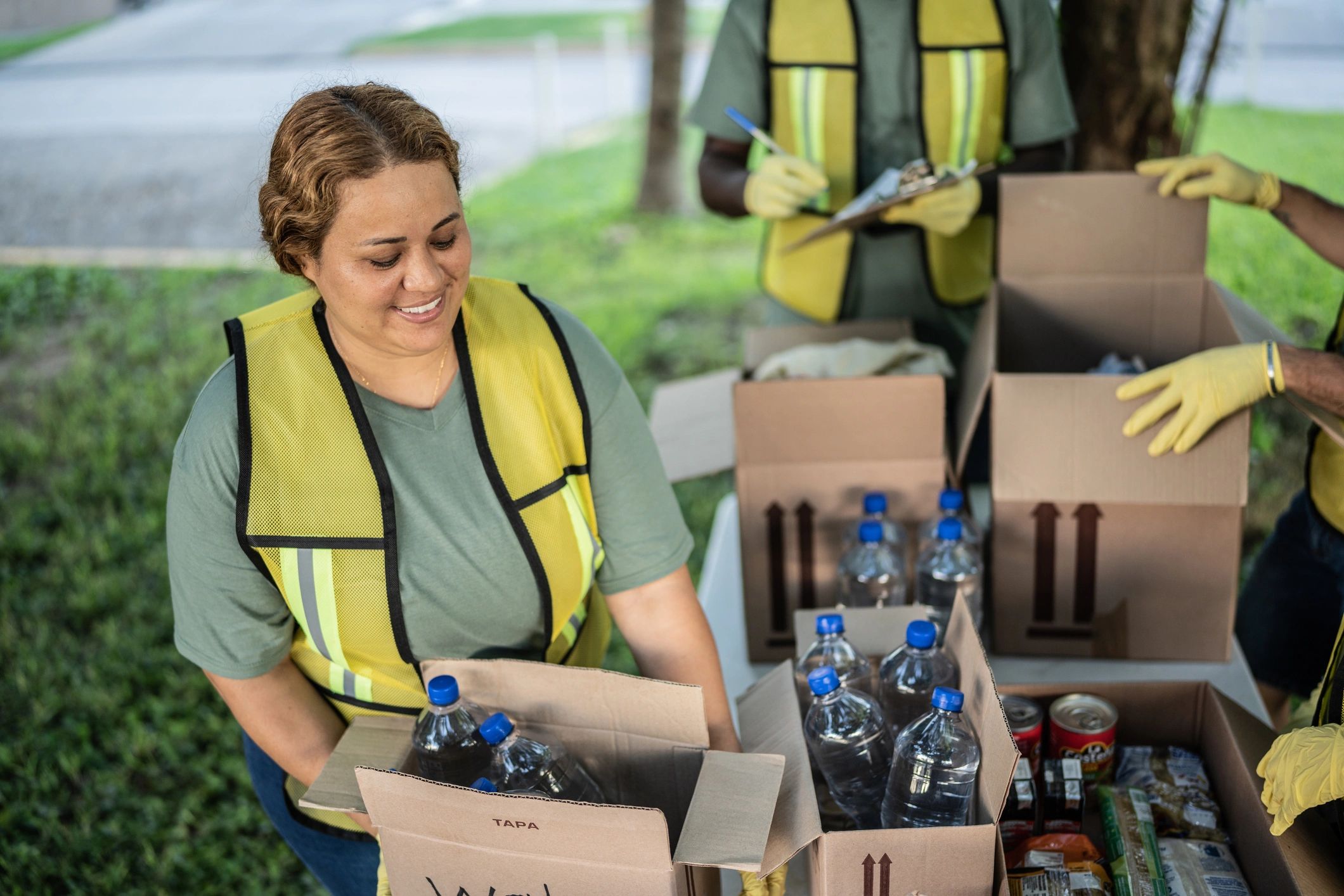 Volunteer carrying a donation box for distribution